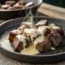 Garlic butter steak bites with parmesan cream sauce served hot